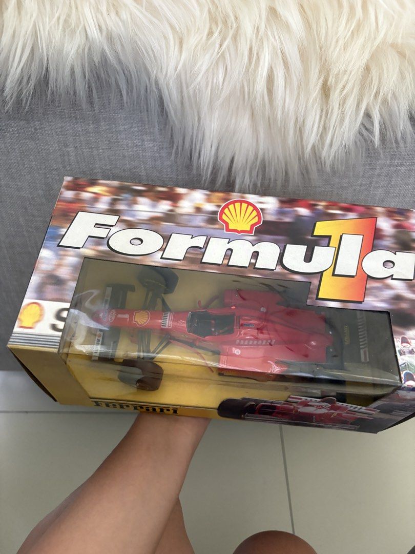 Shell Formula 1 Ferrari Michael Schumacher Diecast Model (Category: Vehicle & Diecast Models) located in Paranaque City. Submitted by craftywoobieph (Listing ID 1469803427, Image 2). Description: - Scale: Collectible Red Ferrari Formula 1 race car model - Edition: Rare Michael Schumacher edition - Packaging: Comes in an official Shell-branded display box with driver graphics - Condition: Great piece for collectors, with minor shelf wear around th