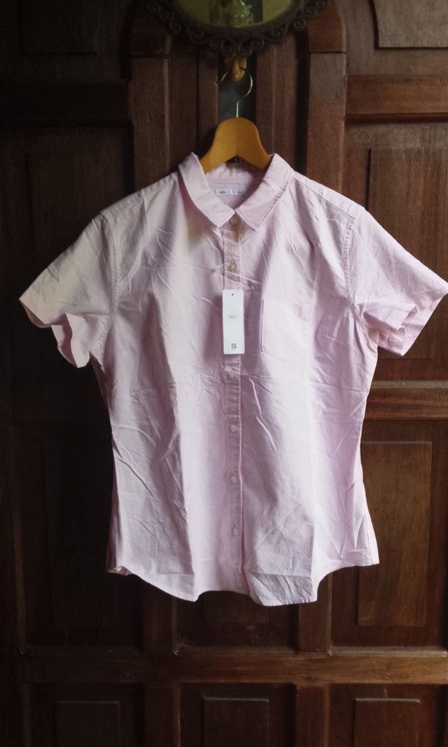 SHORT SLEEVE LATIV (Category: Others Tops) located in Manila. Submitted by plong7 (Listing ID 1469785435, Image 1). Description: DETAILS DIMES 19.5 x 26 COLOR RATE 10/10 NO ISSUE Brand: Lativ Style: Short-sleeve button-down shirt Color: Soft light pink Fabric: 100% Cotton — lightweight, breathable, and comfortable Features: Classic collar, left chest pocket, full button placket Condition: Brand new with tag attached LOCATION: DAVAO DE ORO.