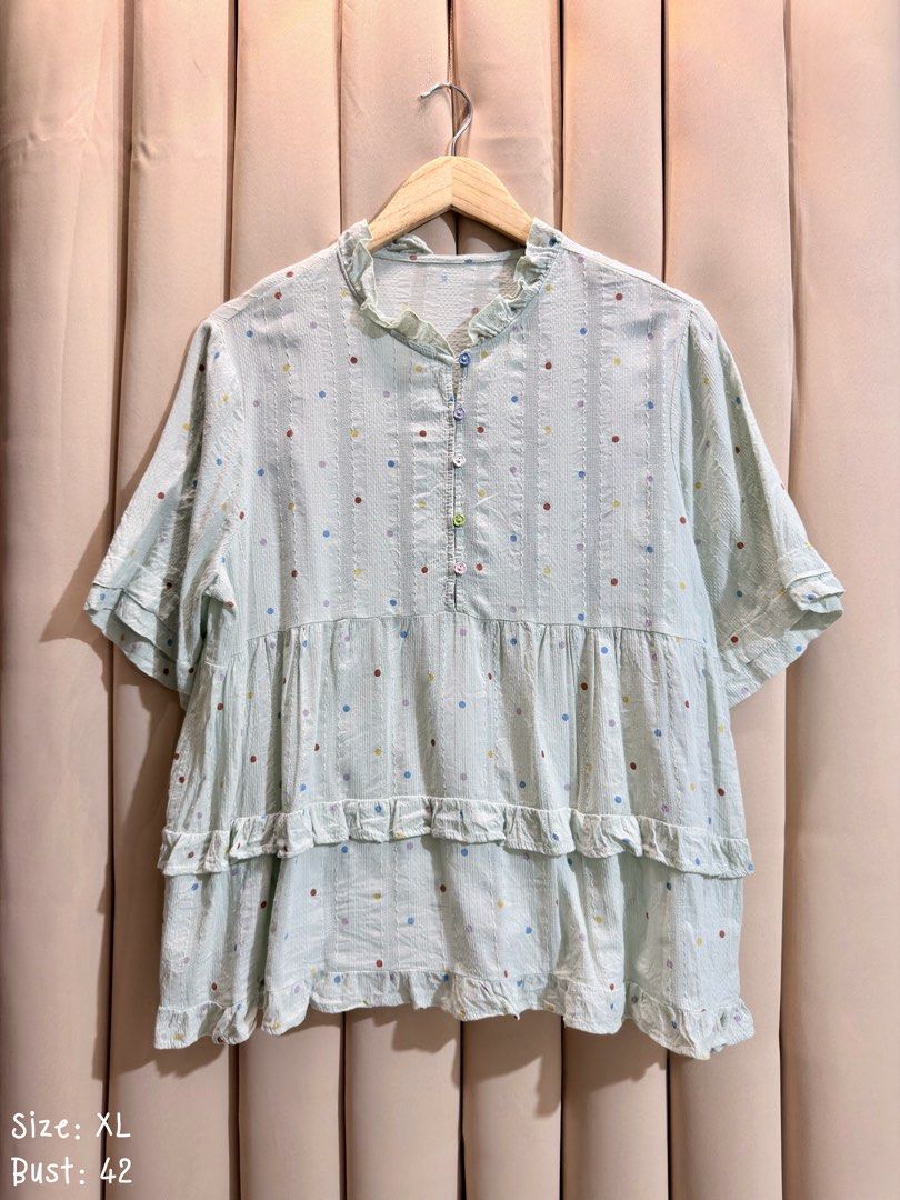 SHORT-SLEEVE TIERED BLOUSE (Category: Blouses) located in Manila. Submitted by glamstylemnl (Listing ID 1469917038, Image 1). Description: ♡ SIZE: XL ♡ BUST: 42 ♡ Swipe left to see the actual color & details ♡ colorful polka dots, ruffled mandarin-style collar, multi-colored buttons down the front, tiered flounce details ♡ HQ • 10/10 ♡ Ready to wear 👚.