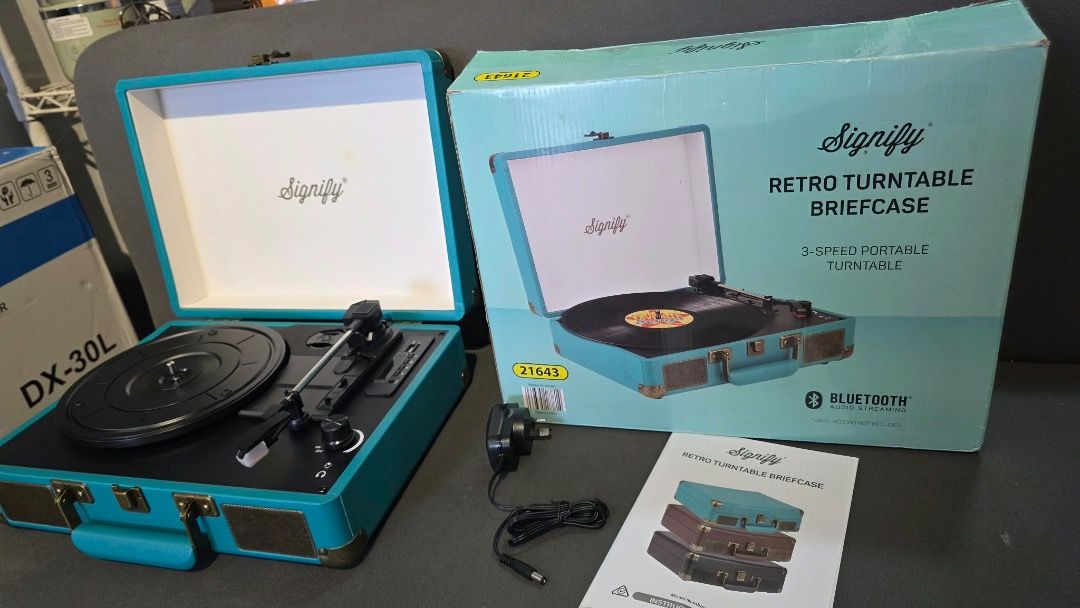 Signify Retro Turntable Briefcase Teal Blue (Category: Briefcases) located in Pulilan. Submitted by sebbii (Listing ID 1469792733, Image 2). Description: - Model: Signify Retro Turntable Briefcase - Color: Teal Blue - Features: Portable vinyl player, built-in speakers, and Bluetooth connectivity - Condition: Clean exterior and needle area, great sound for casual listening - Portability: Easy to pack up and carry around - Inclusions: Original box,