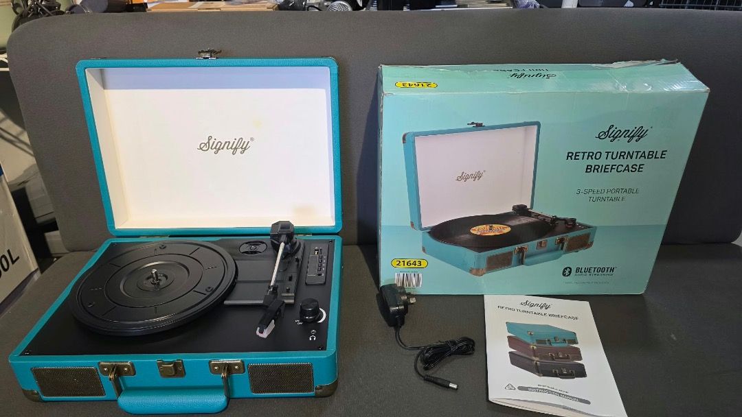 Signify Retro Turntable Briefcase Teal Blue (Category: Briefcases) located in Pulilan. Submitted by sebbii (Listing ID 1469792733, Image 3). Description: - Model: Signify Retro Turntable Briefcase - Color: Teal Blue - Features: Portable vinyl player, built-in speakers, and Bluetooth connectivity - Condition: Clean exterior and needle area, great sound for casual listening - Portability: Easy to pack up and carry around - Inclusions: Original box,