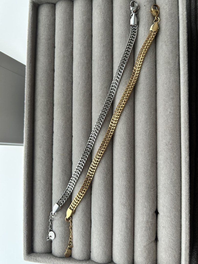 Silver and Gold Chain Bracelets (Category: Bracelets) located in Manila. Submitted by elonlineshop (Listing ID 1469790895, Image 1). Description: - silver-tone and one gold-tone bracelet - Design: Intricate braided link style - Adjustable: Comes with secure lobster clasps and extension chains - Versatile: Wear them stacked together or separately - Everyday wear: Perfect accessories for daily casual or chic looks - Stainless Steel -Unisex.