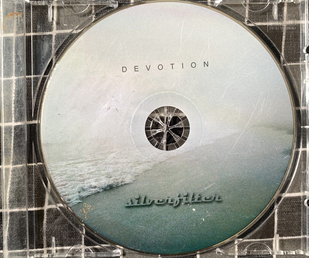 Silverfilter - Devotion CD Album (Category: CDs & DVDs) located in Taguig. Submitted by ahnjr (Listing ID 1469769657, Image 1). Description: - Item: Silverfilter Devotion Audio CD - Packaging: Standard clear plastic jewel case (slight storage scratches on case) - Design: Beautiful beach and waves artwork printed on the disc - Details: Artist and album name clearly displayed on spine and front - Format: Standard compact disc size.