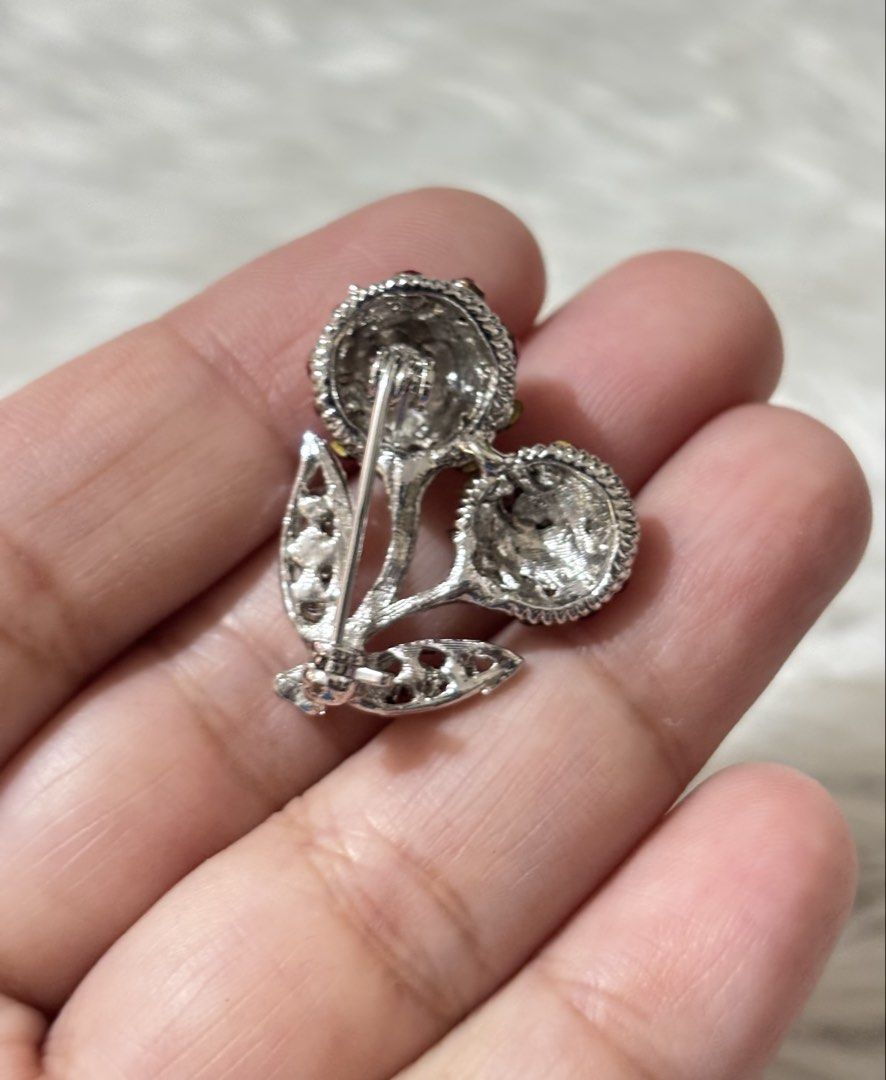Silver-tone cherry brooch (Category: Brooches) located in Paranaque City. Submitted by dalle_closet (Listing ID 1469791191, Image 3). Description: slightly used.