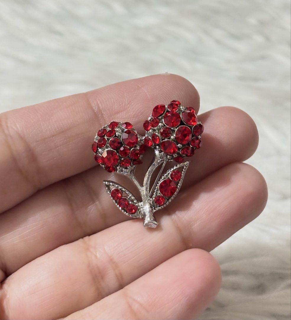 Silver-tone cherry brooch (Category: Brooches) located in Paranaque City. Submitted by dalle_closet (Listing ID 1469791191, Image 1). Description: slightly used.