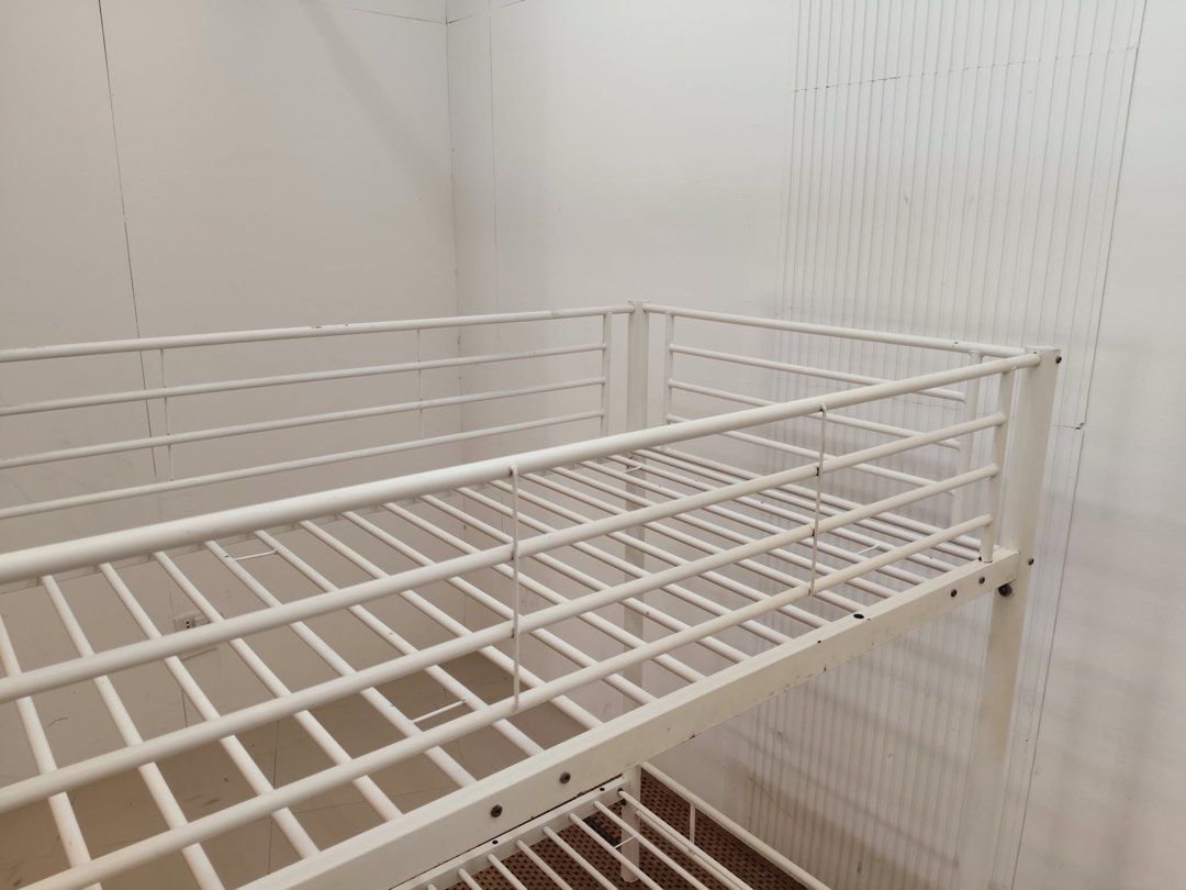 Single double deck (Category: Bed Frames & Mattresses) located in Quezon City. Submitted by matetdevis13 (Listing ID 1469925919, Image 3). Description: White Metal Twin Bunk Bed with Ladder & Safety Rails Price: 10,900 38 x 76 x 63/50/13 In good condition.