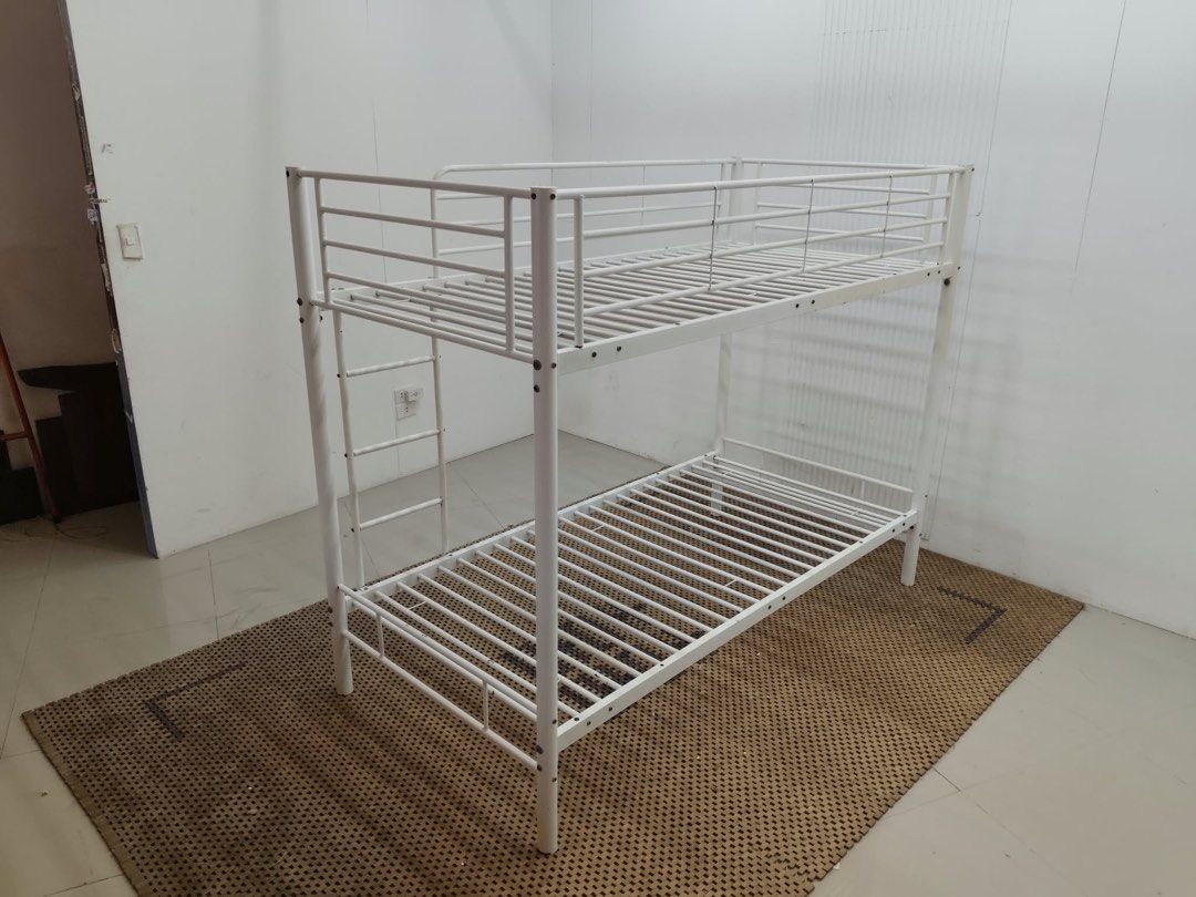 Single double deck (Category: Bed Frames & Mattresses) located in Quezon City. Submitted by matetdevis13 (Listing ID 1469925919, Image 2). Description: White Metal Twin Bunk Bed with Ladder & Safety Rails Price: 10,900 38 x 76 x 63/50/13 In good condition.