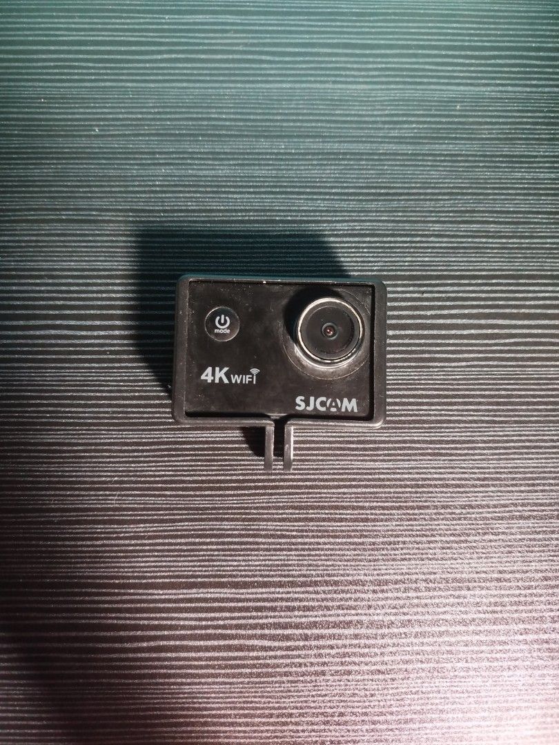 SJCAM GoPro Set (Category: Cameras) located in Manila. Submitted by valgiela22 (Listing ID 1469801278, Image 2). Description: - SJCAM 4K WiFi Action Camera for high-quality outdoor and sports recording - Includes a sturdy black handheld monopod grip and tripod mount - Features protective camera housing with convenient side USB port access - Easy operation with front mode/power button and durable lens - Standard mounting bracket included, fully co