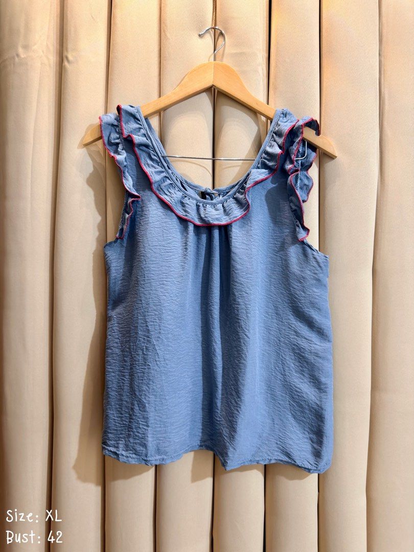 SLEEVELESS TOP (Category: Sleeveless) located in Manila. Submitted by glamstylemnl (Listing ID 1469917798, Image 1). Description: ♡ SIZE: XL ♡ BUST: 42 ♡ Swipe left to see the actual color & details ♡ ruffled scoop neckline, contrasting red stitching, relaxed silhouette ♡ HQ • 10/10 ♡ Ready to wear 👚.