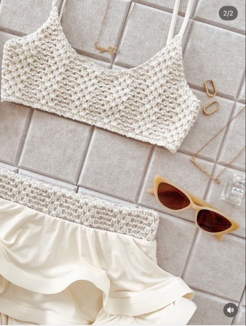 Small - Eighth Mermaid | Nikita Set Cream (Category: Bikinis & Swimsuits) located in Las Pinas. Submitted by charmeecharm (Listing ID 1469788251, Image 1). Description: - Item: Nikita Bikini Set - Color: Cream - Condition: Like new - Details: Crochet knit crop top with spaghetti straps and matching high-waisted layered ruffle shorts.
