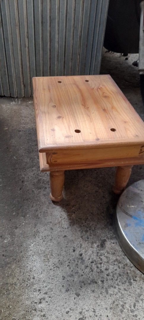 Small Wooden Stool with Turned Legs (Category: Chairs) located in Valenzuela. Submitted by newbear.425b6e (Listing ID 1469767968, Image 2). Description: - Solid wood construction with a sturdy and compact build - Features a rectangular top with four unique circular indentations - Elegant four turned wooden legs - Beautiful natural wood grain finish throughout - Available for quick pickup or delivery -Japan surplus .