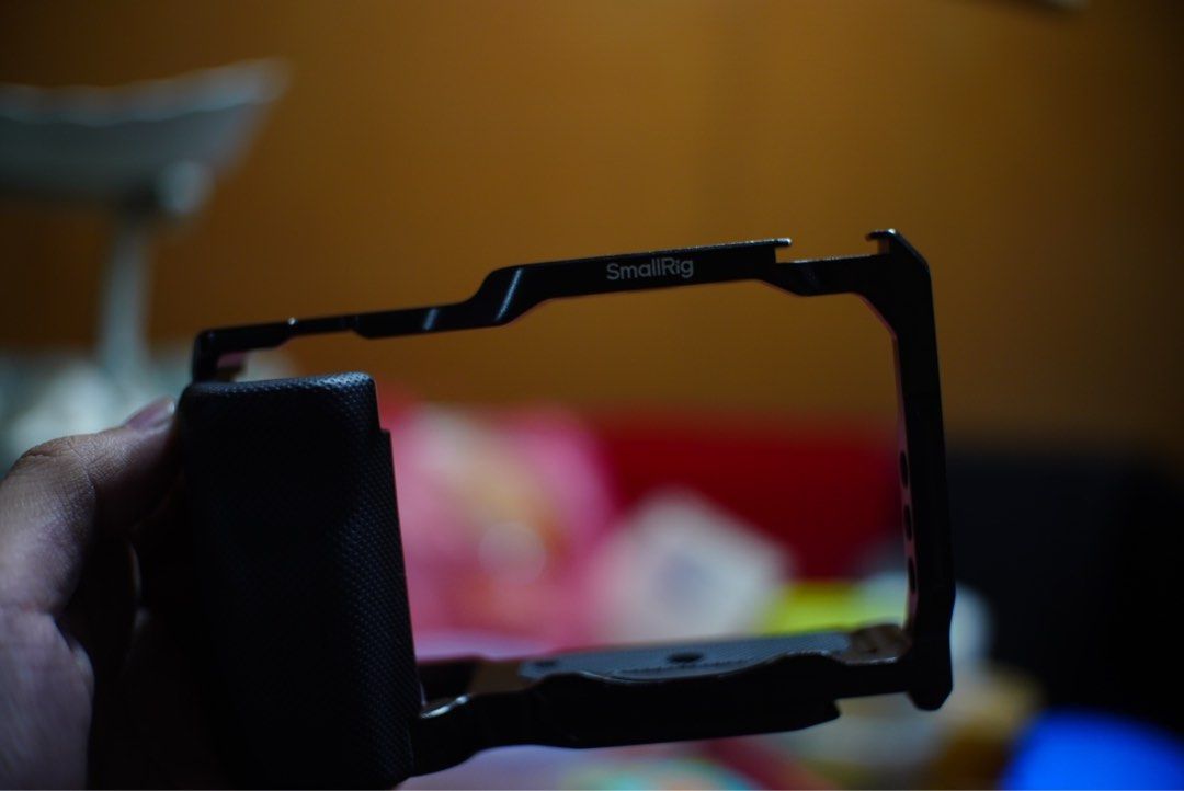 SmallRig Camera Cage for Sony zve10 (Category: Camera Bags & Carriers) located in Manila. Submitted by josephignacioo (Listing ID 1469824295, Image 1). Description: - Durable black aluminium SmallRig camera cage - Comfortable built-in grip section on the side - Multiple threaded mounting holes, cold shoe mounts, and strap eyelets - Custom cutouts for camera body controls ('OFF / ON', 'C1') - Standard mounting screw slots on the bottom plate - Sol