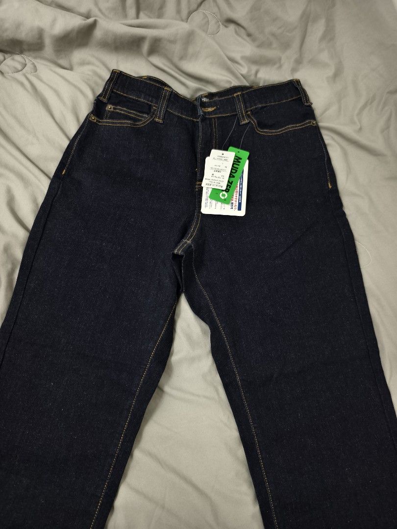 Smile Land Dark Denim Jeans Size L (Category: Jeans) located in Angeles City. Submitted by measaliman02351 (Listing ID 1469858263, Image 1). Description: - Brand: Smile Land - Size: L - Condition: Brand new with original store tags attached - Wash: Classic dark wash with contrast stitching - Fit: Straight leg cut - Details: Trendy multiple button closures at the waistband - Style: Versatile everyday staple piece.