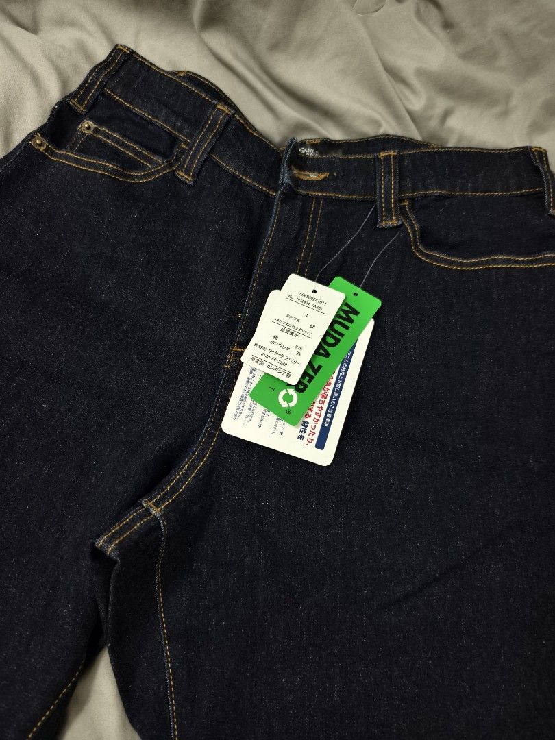 Smile Land Dark Denim Jeans Size L (Category: Jeans) located in Angeles City. Submitted by measaliman02351 (Listing ID 1469858263, Image 2). Description: - Brand: Smile Land - Size: L - Condition: Brand new with original store tags attached - Wash: Classic dark wash with contrast stitching - Fit: Straight leg cut - Details: Trendy multiple button closures at the waistband - Style: Versatile everyday staple piece.