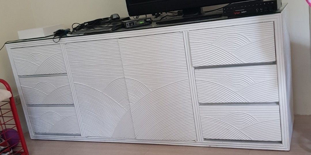 SOLID WOOD White Textured Credenza Sideboard Storage Cabinet (Category: Shelves, Cabinets & Racks) located in Paranaque City. Submitted by nicessities (Listing ID 1469762594, Image 1). Description: SOLID WOOD TEXTURED LONG CABINET Location: Parañaque RFS: migrating Color: White - Design: Stylish textured wave pattern on doors and drawers - Storage: 3 drawers on the left, 3 drawers on the right, and wide-opening center cabinet doors - Sturdy Build