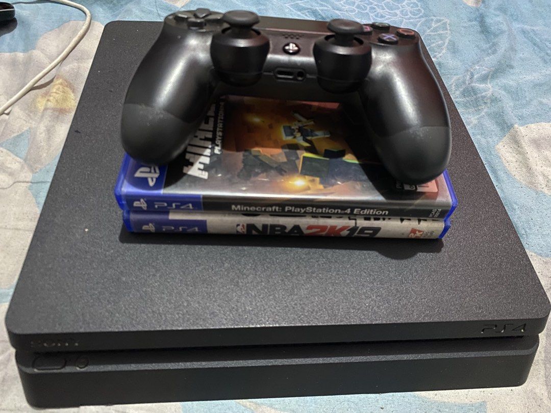 Sony PlayStation 4 Slim Console with Controller and Games (Category: PlayStation) located in Manila. Submitted by devilsdontcry (Listing ID 1469774418, Image 1). Description: - Console: Sony PlayStation 4 Slim (Black) - Controller: 1x Original DualShock 4 Wireless Controller - Games included: Minecraft PS4 Edition & NBA 2K19 (Physical Discs) - Condition: Adult-owned, clean physical appearance, powers up normally - Inclusions: Console, controller,