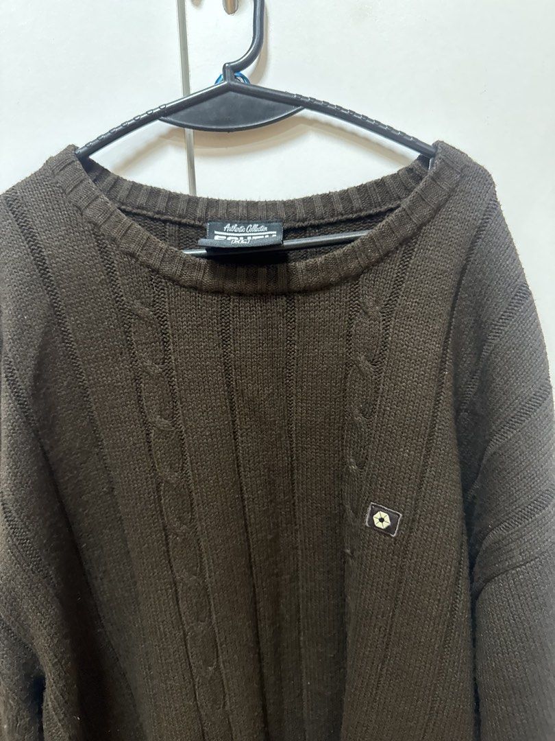 Southpole Brown Cable Knit Sweater (Category: Coats, Jackets and Outerwear) located in Manila. Submitted by quintessesommerset (Listing ID 1469845343, Image 2). Description: - Brand: Southpole - Size: XL 24x29 - Color: Deep Brown - Material: Heavyweight chunky knit with vertical ribbed patterns - Design: Classic crew neck with a small square logo patch on the chest - Fit: Standard fit with ribbed cuffs and hem - Condition: Great for cold weather 
