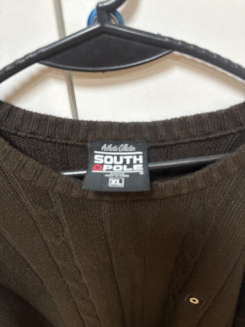 Southpole Brown Cable Knit Sweater (Category: Coats, Jackets and Outerwear) located in Manila. Submitted by quintessesommerset (Listing ID 1469845343, Image 3). Description: - Brand: Southpole - Size: XL 24x29 - Color: Deep Brown - Material: Heavyweight chunky knit with vertical ribbed patterns - Design: Classic crew neck with a small square logo patch on the chest - Fit: Standard fit with ribbed cuffs and hem - Condition: Great for cold weather 