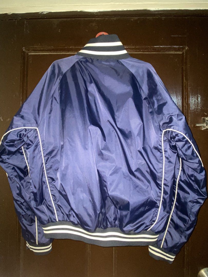 Southpole Navy Blue Varsity Bomber Jacket Size L (Category: Coats, Jackets and Outerwear) located in Manila. Submitted by almazankyle19 (Listing ID 1469879767, Image 3). Description: - Brand: Southpole - Color: Navy Blue - Style: Classic varsity bomber jacket with full zip closure - Details: Embroidered logo across the chest, striped ribbed collar, cuffs, and hem, warm quilted inner lining - Size on tag: L (16-18) - Measurements: Width 22 inches,