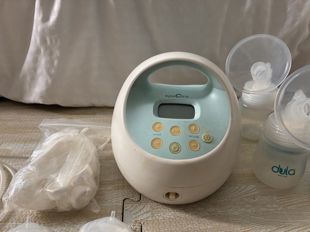 Spectra S1 Plus Double Electric Breast Pump with Accessories (Category: Breastfeeding & Bottle Feeding) located in Cagayan de Oro. Submitted by xxadl (Listing ID 1469795042, Image 2). Description: - Spectra S1 Plus double electric breast pump (hospital-grade) - Includes motor unit, power adapter/ charger, 2 tubing (with 2 extra tubes), 2 valves (with 3 extra), backflow protectors (with 1 extra), and 2 Dula bottles - Built-in rechargeable battery 