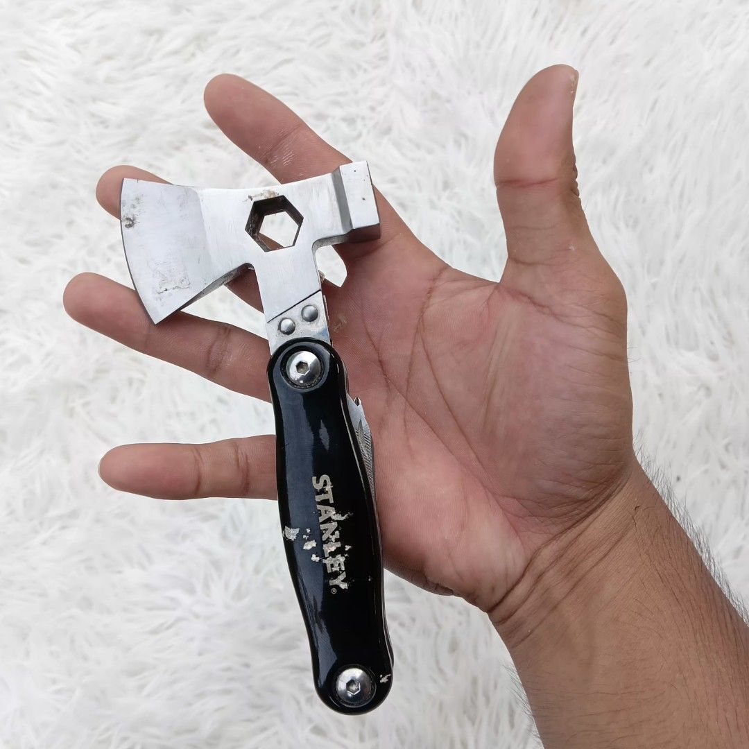 Stanley Mini Multi-Tool Axe Hammer Pocket Knife (Category: Construction Tools & Equipment) located in Gattaran. Submitted by thrift_wiseph (Listing ID 1469857224, Image 3). Description: - Brand: Stanley - 3-in-1 core tools: Axe, hammer, and pocket knife - Built-in fold-out tools: Saw blade, metal file, flathead screwdriver, and knife blade - Durable and sturdy black handle - Pocket-sized, compact, and easy to carry - Ideal for camping, outdoor ta