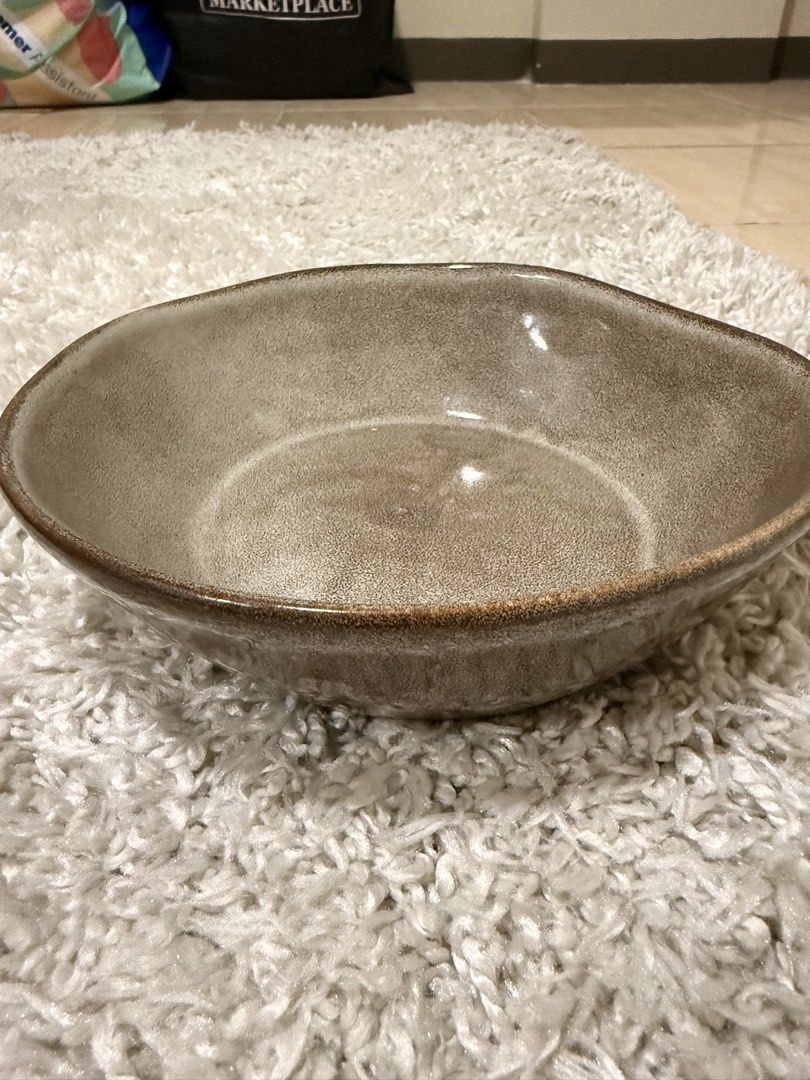Stoneware ceramic serving bowl brown speckled glaze (Category: Dinnerware & Cutlery) located in Mandaluyong City. Submitted by riz_040521 (Listing ID 1469797881, Image 1). Description: - Speckled brown glaze with a handmade, irregular rim - Deep basin perfect for soups, salads, and side dishes - Heavy and sturdy ceramic build - Unglazed white ring on the bottom - Excellent, clean condition and ready for use -4 pieces for 480.