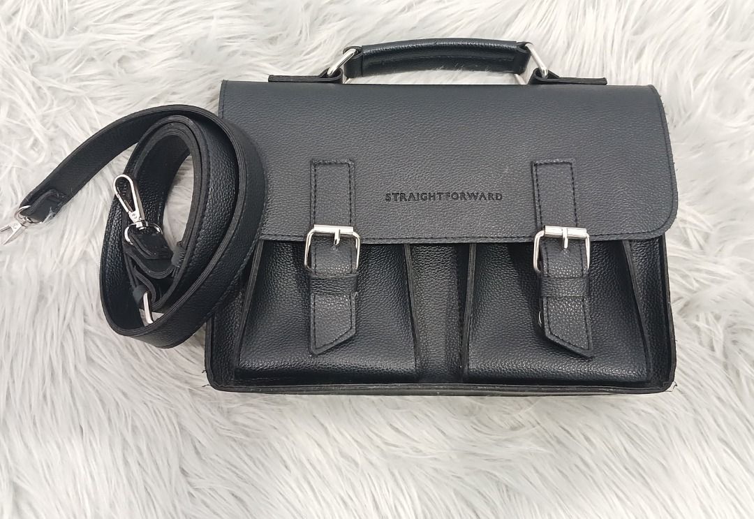 Straightforward Black Satchel Crossbody Bag (Category: Cross-body Bags) located in Pasig City. Submitted by chinTM (Listing ID 1469775758, Image 1). Description: - Brand: Straightforward - Material: Daily Vegan Leather (DVL) Care - Design: Clean and structured everyday size - Storage: Dual front pockets with secure buckle closures and silver hardware - Carry options: Includes a top handle for hand carry and a long, detachable crossbody sling -Fla