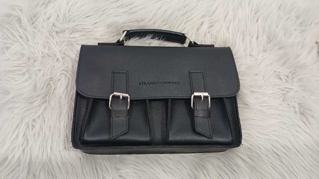 Straightforward Black Satchel Crossbody Bag (Category: Cross-body Bags) located in Pasig City. Submitted by chinTM (Listing ID 1469775758, Image 2). Description: - Brand: Straightforward - Material: Daily Vegan Leather (DVL) Care - Design: Clean and structured everyday size - Storage: Dual front pockets with secure buckle closures and silver hardware - Carry options: Includes a top handle for hand carry and a long, detachable crossbody sling -Fla