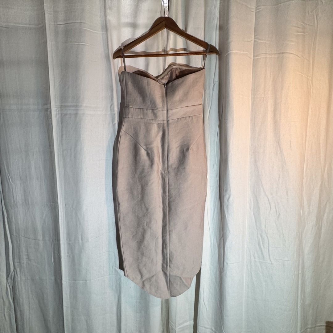 Strapless Dress - Beige - ASOS (Category: Dresses) located in Marikina City. Submitted by repurpose_studio (Listing ID 1469792886, Image 3). Description: - Color: Beige - Original Price at Php 3,500.00 - Style: Strapless midi dress with structured silhouette - Details: Front keyhole cut-out, twisted bodice, draped skirt, and side slit - Condition: Worn once, freshly dry-cleaned, and ready to wear - Ideal for: Weddings, parties, and formal events.