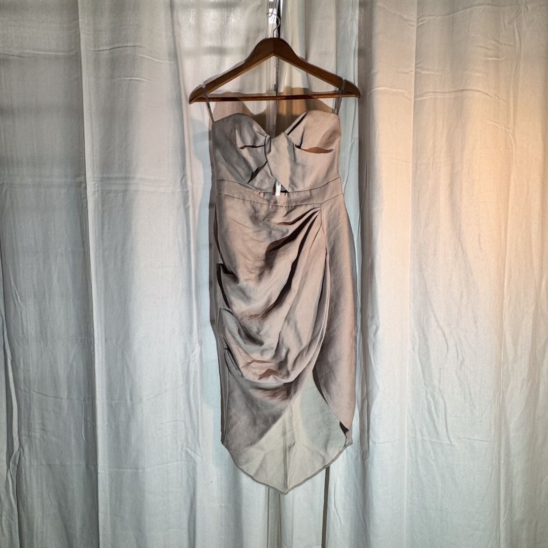 Strapless Dress - Beige - ASOS (Category: Dresses) located in Marikina City. Submitted by repurpose_studio (Listing ID 1469792886, Image 2). Description: - Color: Beige - Original Price at Php 3,500.00 - Style: Strapless midi dress with structured silhouette - Details: Front keyhole cut-out, twisted bodice, draped skirt, and side slit - Condition: Worn once, freshly dry-cleaned, and ready to wear - Ideal for: Weddings, parties, and formal events.