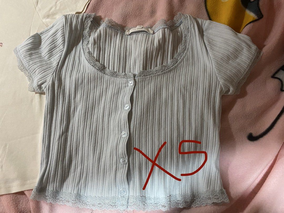 Strawberry Lace Trim Tops Bundle (Category: Blouses) located in Batangas. Submitted by xi_sapmata (Listing ID 1469834202, Image 2). Description: - Bundle of 2 tops: Cream graphic tee & Light blue ribbed crop top - Blue Crop Top: Ribbed texture, button-up front, delicate lace trim on scoop neck and hem, Size XS (cropped if S) - Strawberry top (S) - may onting errors lang Tingi @ 60 ea .