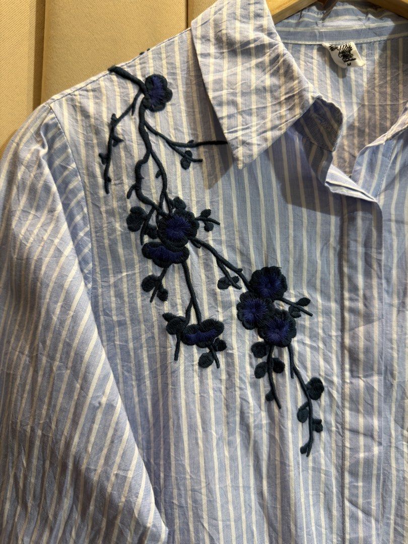 STRIPED LONGSLEEVE SHIRT (Category: Longsleeves) located in Manila. Submitted by glamstylemnl (Listing ID 1469913487, Image 2). Description: ♡ SIZE: M ♡ BUST: 36 ♡ Swipe left to see the actual color & details ♡ dark blue floral branch embroidery on the right chest, single patch pocket ♡ HQ • 10/10 ♡ Ready to wear 👚.