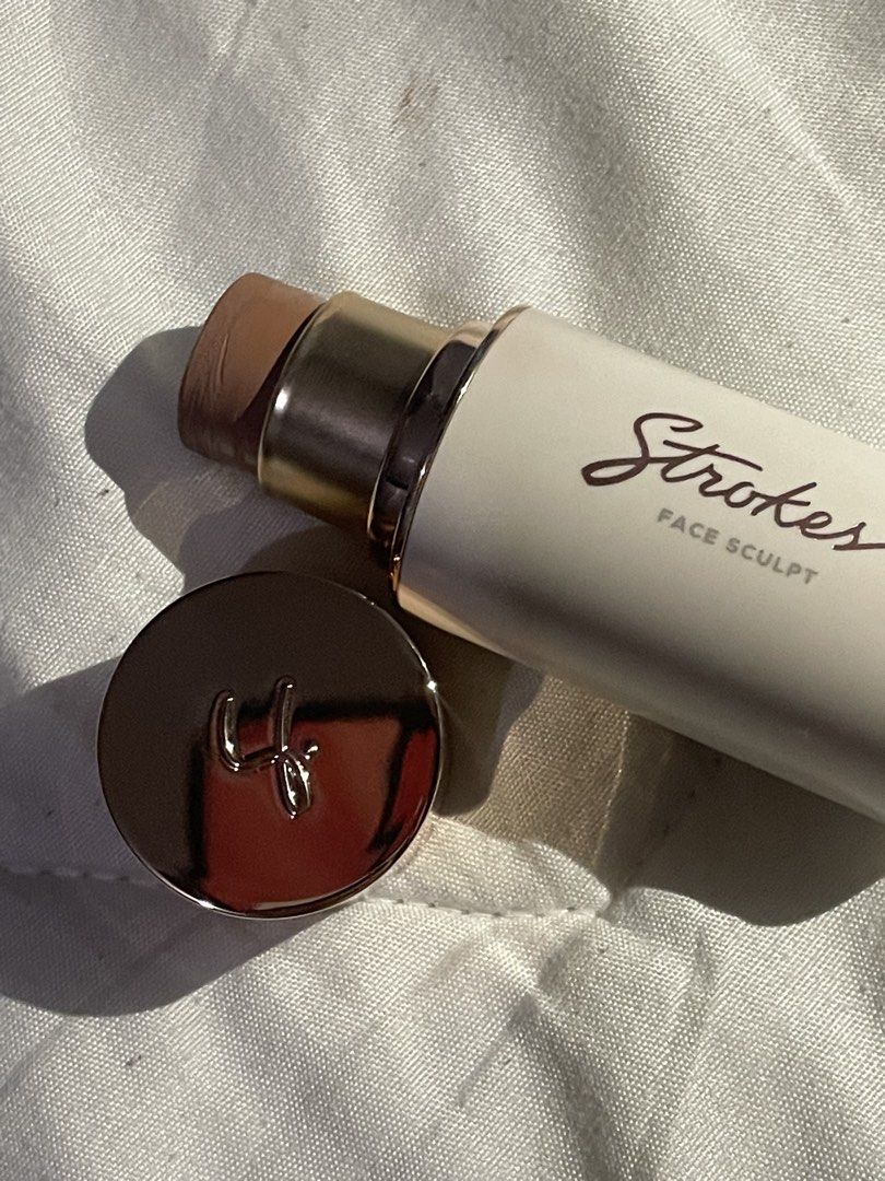 Strokes Face Sculpt (Category: Makeup) located in Manila. Submitted by zade__ (Listing ID 1469853919, Image 2). Description: - Brand: Strokes - Product: Cream contour stick - Condition: Swatched once, basically full - Features: Smooth, highly blendable formula, twist-up tube with metallic cap - Perfect for: Defining cheekbones and nose, compact for makeup bags - Fulfillment: Available for local pickup or mail out.