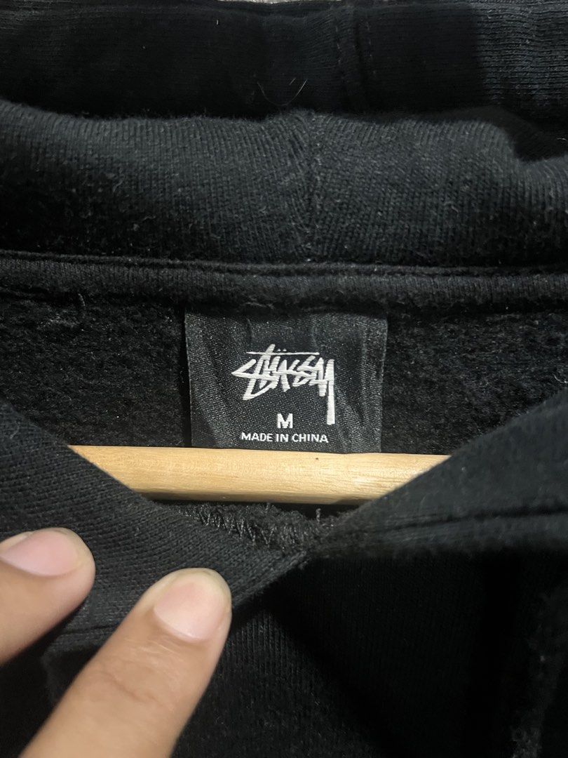 Stüssy Black Hoodie (Category: Hoodies) located in Manila. Submitted by beyondclos3t (Listing ID 1469867003, Image 3). Description: - Brand: Stüssy - Color: Black - Size: Medium - Material: 80% Cotton, 20% Polyester (Made in China) - Design: Signature Stüssy logo on chest - Features: Drawstring hood, front kangaroo pocket - Condition: Clean design, perfect everyday winter essential.