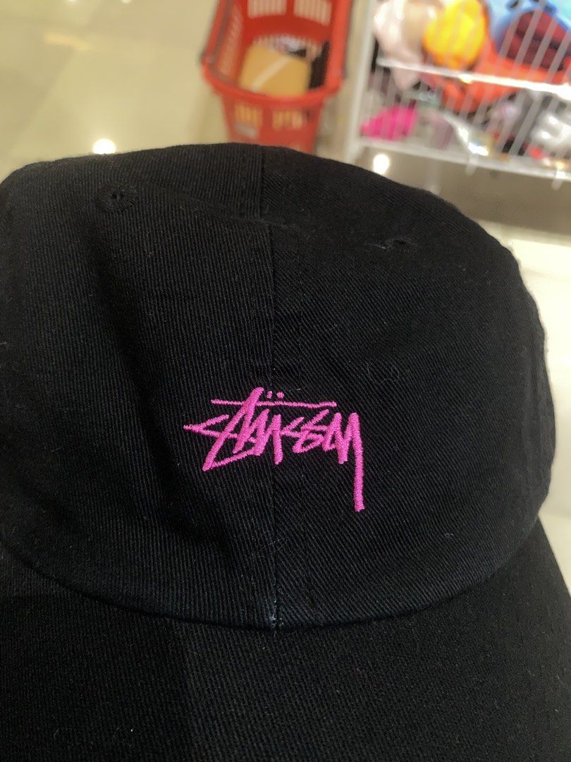 Stussy Black Cap with Pink Logo (Category: Caps & Hats) located in Manila. Submitted by jedgarments0 (Listing ID 1469786530, Image 2). Description: - Authentic Stussy black baseball cap - Eye-catching bright pink embroidered logo on the front - 100% comfortable cotton construction - Adjustable back strap for a custom fit - Structured panels and clean curved brim - Interior tags and holographic authenticity sticker intact - Condition: Excellent, c