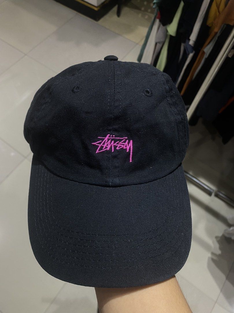 Stussy Black Cap with Pink Logo (Category: Caps & Hats) located in Manila. Submitted by jedgarments0 (Listing ID 1469786530, Image 1). Description: - Authentic Stussy black baseball cap - Eye-catching bright pink embroidered logo on the front - 100% comfortable cotton construction - Adjustable back strap for a custom fit - Structured panels and clean curved brim - Interior tags and holographic authenticity sticker intact - Condition: Excellent, c
