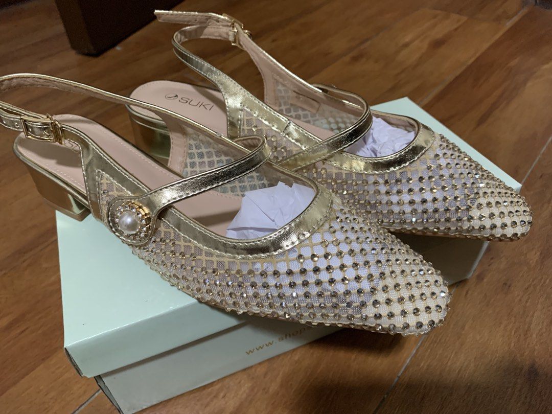 SUKI Gold Rhinestone Mesh Heels Size 40 (Category: Heels) located in Antipolo. Submitted by prelovedbyj4 (Listing ID 1469853580, Image 3). Description: - Brand/Model: SUKI Gold Heels (Article 408) - Size: 40 - Design: Mesh upper with rhinestones, slingback strap, pearl buckle, and metallic gold trim - Heel: Comfortable low block heel - Condition: Used once and with original box - Original Retail Price: PHP 1,699.00.