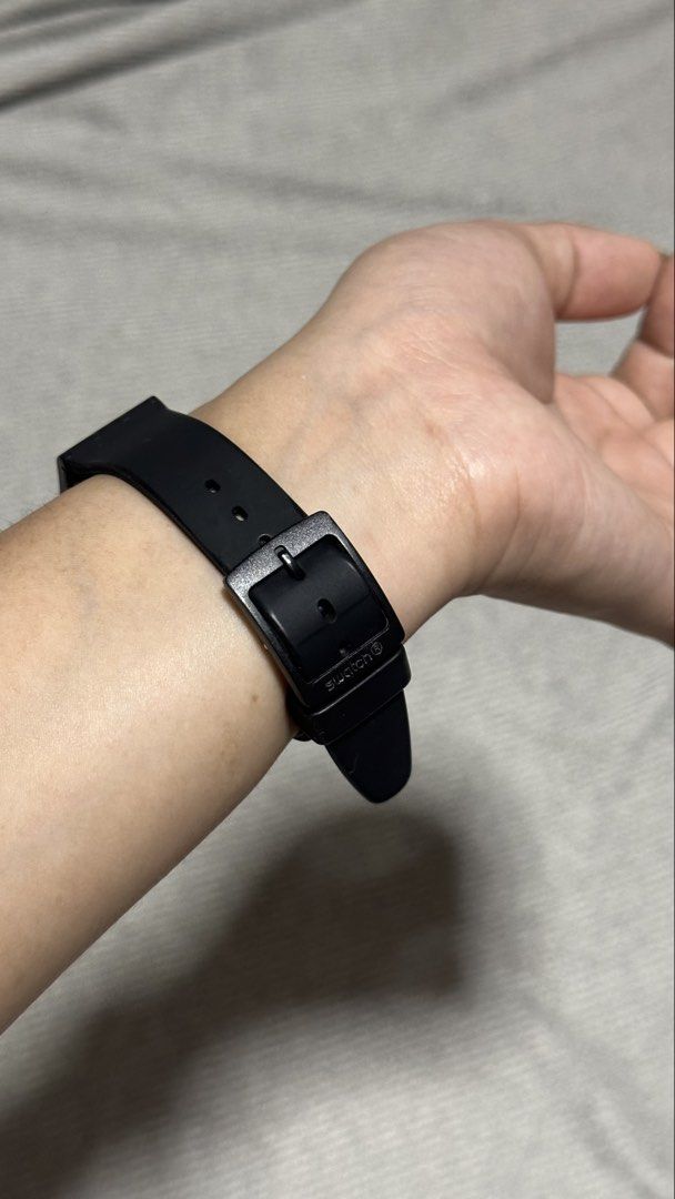 Swatch Black Analog Wristwatch (Category: Women's Watches) located in Bantay. Submitted by e.loi.sa (Listing ID 1469783113, Image 2). Description: - Authentic Swiss-made black Swatch wristwatch - Minimalist black dial with easy-to-read white Arabic numerals and hands - Comfortable and durable black silicone strap with buckle closure - Lightweight design ideal for daily wear - Versatile style that matches any outfit.