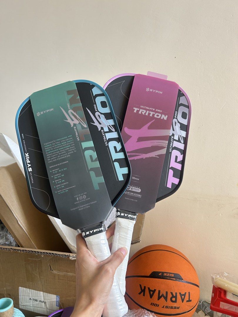Sypik Ultimate Pro Triton Pickleball Paddle (Category: Racket and Ball Sports) located in Cavite. Submitted by _schmyla (Listing ID 1469888254, Image 2). Description: - Brand new Sypik Ultimate Pro Triton pickleball paddle in original packaging - 18mm carbon fiber power air construction for maximum power - Built-in NFC chip accessible for authenticity and stats - Includes official 6-month warranty tag attached - Multiple colors available to match