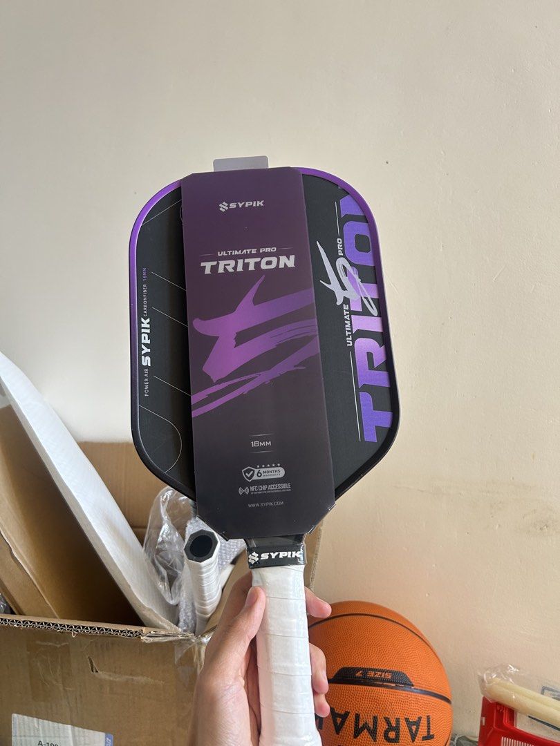 Sypik Ultimate Pro Triton Pickleball Paddle (Category: Racket and Ball Sports) located in Cavite. Submitted by _schmyla (Listing ID 1469888254, Image 1). Description: - Brand new Sypik Ultimate Pro Triton pickleball paddle in original packaging - 18mm carbon fiber power air construction for maximum power - Built-in NFC chip accessible for authenticity and stats - Includes official 6-month warranty tag attached - Multiple colors available to match