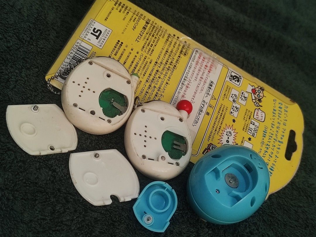 Tamagotchi (take all) (Category: Interactive Toys) located in Manila. Submitted by olx156 (Listing ID 1469782088, Image 3). Description: sealed untested green mid button issue..
