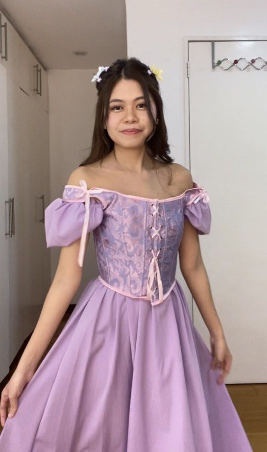 Tangled Rapunzel Costume (XS-S) (Category: Dresses) located in Taguig. Submitted by lindsey18 (Listing ID 1469820119, Image 1). Description: Tangled Rapunzel Costume Selling my version of this costume 💐 Everything is bought from Shein but I had the lilac dress altered to be more suitable as an off-shoulder style. Selling as a SET which includes the dress, corset, and flowers. Take all only. The lilac dress is smocked at the back so it can fit up