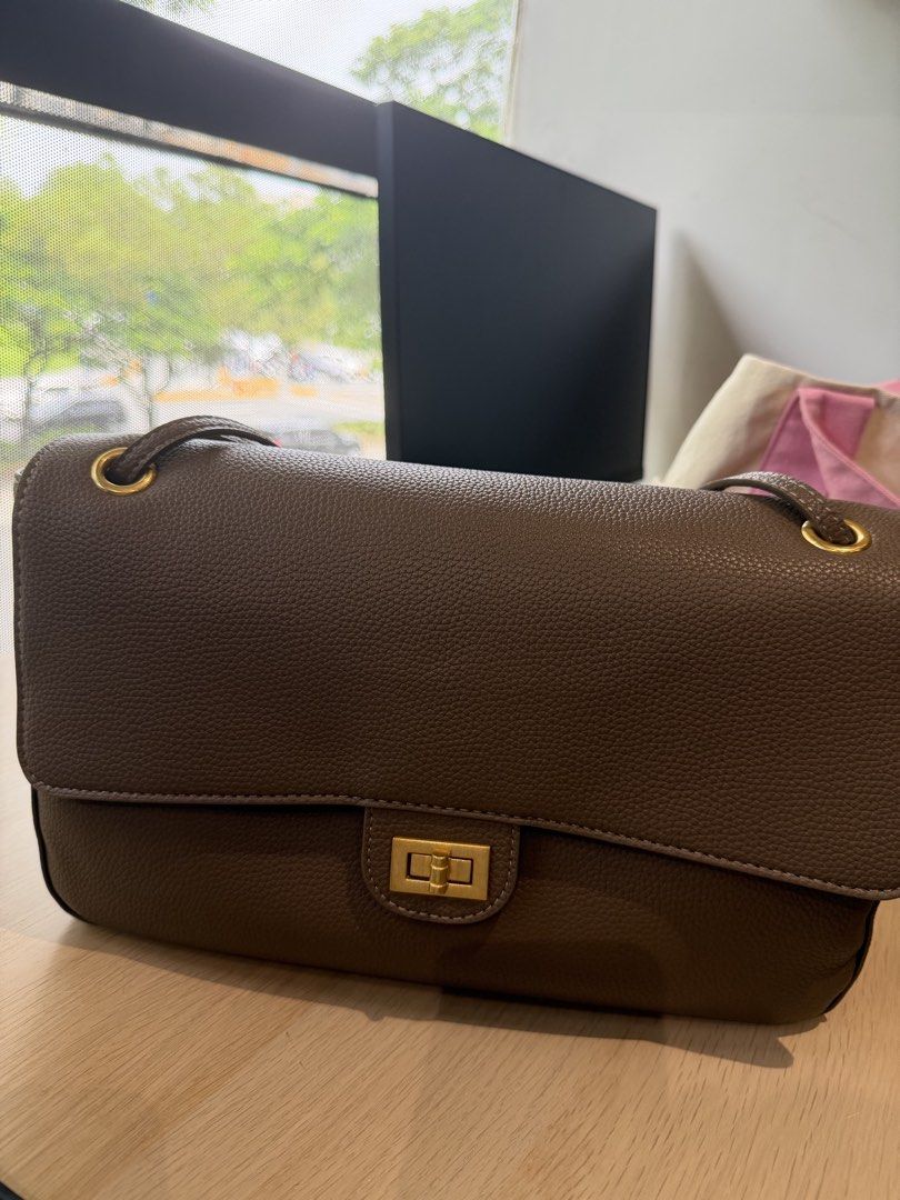 Taupe Leather Shoulder Bag with Gold Hardware (Category: Luxury Bags & Wallets) located in Imus. Submitted by cbzaragoza (Listing ID 1469782232, Image 1). Description: Taupe soft leather bag with adjustable strap, can be worn as crossbody and shoulder bag with gold hardware Double flap inside with burgurdy interior .
