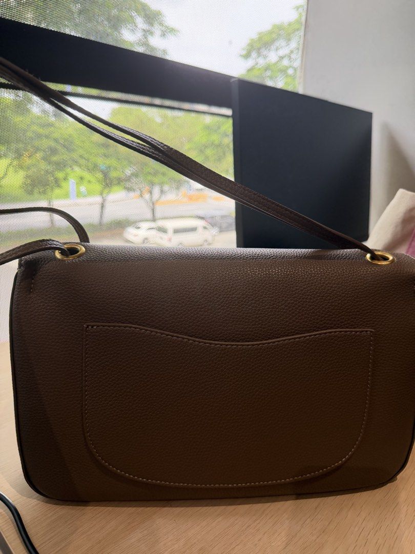 Taupe Leather Shoulder Bag with Gold Hardware (Category: Luxury Bags & Wallets) located in Imus. Submitted by cbzaragoza (Listing ID 1469782232, Image 3). Description: Taupe soft leather bag with adjustable strap, can be worn as crossbody and shoulder bag with gold hardware Double flap inside with burgurdy interior .