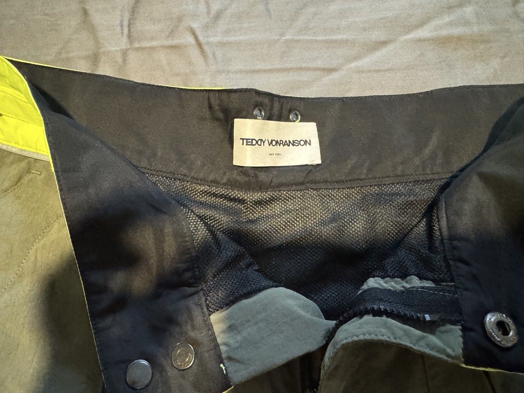 Teddy Vonranson Olive Green Technical Shorts Size 30 (Category: Shorts) located in Taguig. Submitted by dependingonvibe (Listing ID 1469783372, Image 2). Description: - Brand: Teddy Vonranson New York - Size: 30 - Color: Olive green with neon yellow waistband and blue/burgundy side piping - Features: Adjustable side buckle straps, mesh lining, multiple utility pockets, and drawstring closure - Origin: Made in USA - Condition: Excellent.