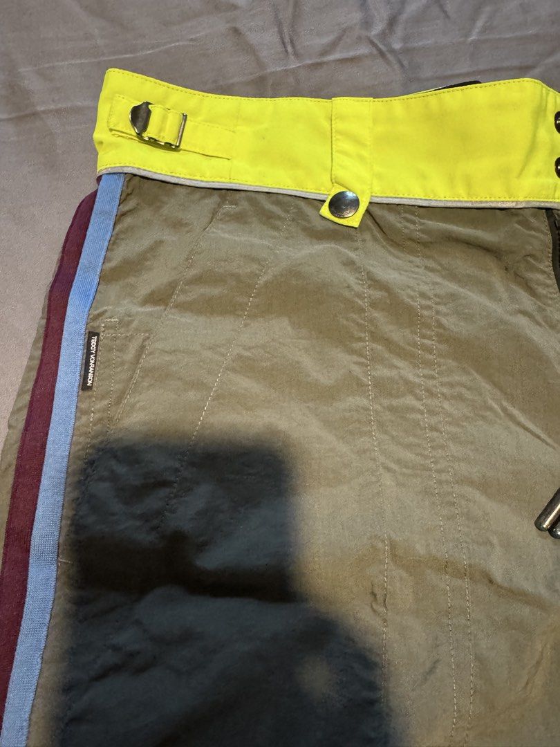 Teddy Vonranson Olive Green Technical Shorts Size 30 (Category: Shorts) located in Taguig. Submitted by dependingonvibe (Listing ID 1469783372, Image 3). Description: - Brand: Teddy Vonranson New York - Size: 30 - Color: Olive green with neon yellow waistband and blue/burgundy side piping - Features: Adjustable side buckle straps, mesh lining, multiple utility pockets, and drawstring closure - Origin: Made in USA - Condition: Excellent.