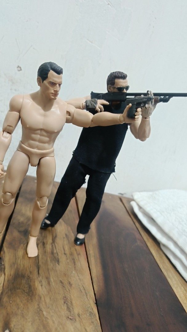 Terminator arnold only (Category: Figurines & Statues) located in Caloocan City. Submitted by purefuds (Listing ID 1469793638, Image 3). Description: - Set includes 2 fully articulated action figures for dynamic posing - Figure 1: Black sleeveless top, black pants, sunglasses, and shotgun - Figure 2: Shirtless, barefoot, handgun, and battle-damaged Terminator head sculpt - Fully poseable with multiple articulation points - Note: Cat shown in phot