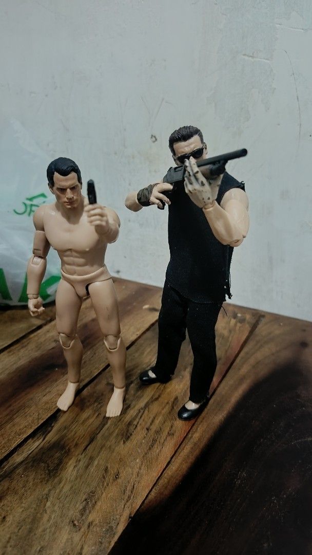 Terminator arnold only (Category: Figurines & Statues) located in Caloocan City. Submitted by purefuds (Listing ID 1469793638, Image 2). Description: - Set includes 2 fully articulated action figures for dynamic posing - Figure 1: Black sleeveless top, black pants, sunglasses, and shotgun - Figure 2: Shirtless, barefoot, handgun, and battle-damaged Terminator head sculpt - Fully poseable with multiple articulation points - Note: Cat shown in phot