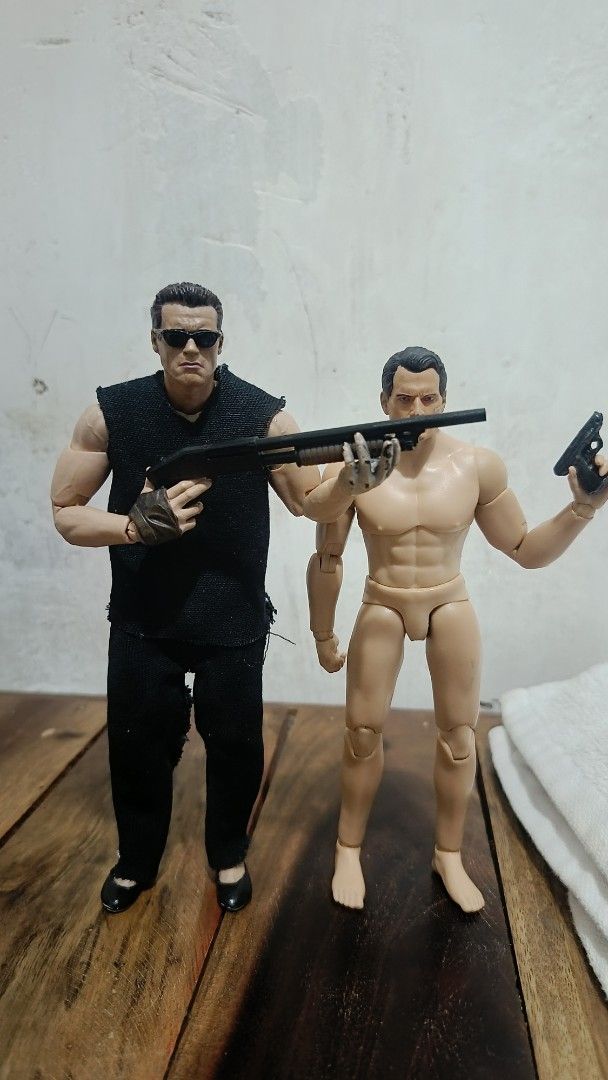 Terminator arnold only (Category: Figurines & Statues) located in Caloocan City. Submitted by purefuds (Listing ID 1469793638, Image 1). Description: - Set includes 2 fully articulated action figures for dynamic posing - Figure 1: Black sleeveless top, black pants, sunglasses, and shotgun - Figure 2: Shirtless, barefoot, handgun, and battle-damaged Terminator head sculpt - Fully poseable with multiple articulation points - Note: Cat shown in phot