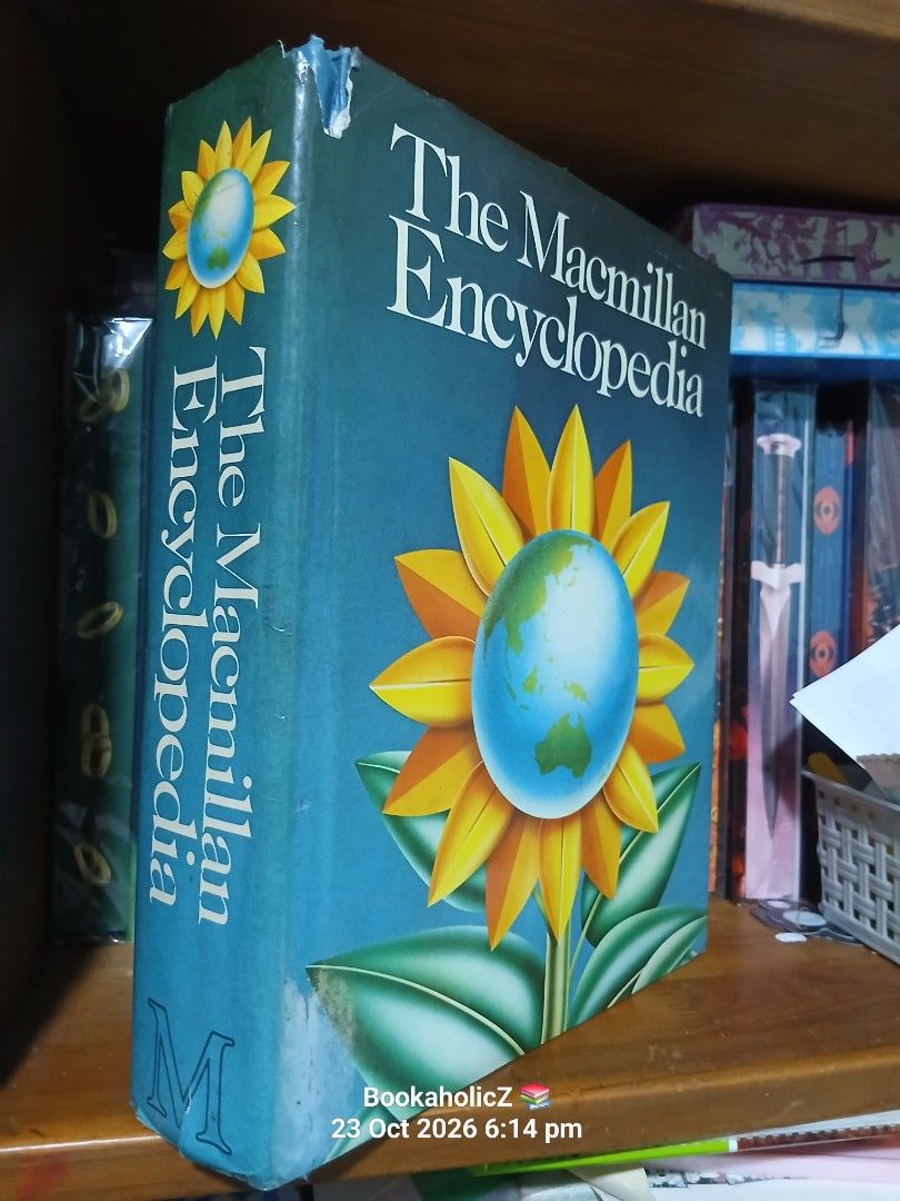 The Macmillan Encyclopedia Reference Hardcover Book (Category: Storybooks) located in Antipolo. Submitted by bookaholicz_dettori (Listing ID 1469858852, Image 2). Description: - Item: The Macmillan Encyclopedia (Hardcover, Single Volume) - Cover: Blue dust jacket with sunflower and earth graphic (minor shelf wear) - Content: 1,376 pages, 25,000 entries, 1,500,000 words - Visuals & Maps: 1,234 line illustrations and 20 world maps - Condition: Bind